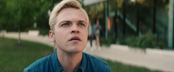 Movie still from “Gen V” (2023), created by Eric Kripke – A person with blond hair; Close Up shot, Low angle