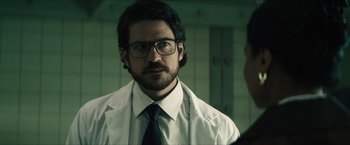 Movie still from “Gen V” (2023), created by Eric Kripke – A man in a white shirt and a tie; Close Up shot, Over the shoulder angle