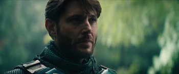 Movie still from “Gen V” (2023), created by Eric Kripke – A person with a beard; Close Up shot, Over the shoulder angle