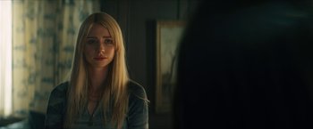 Movie still from “Gen V” (2023), created by Eric Kripke – A woman is looking at a mirror in a room; Close Up shot, Over the shoulder angle