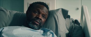 Movie still from “Gen V” (2023), created by Eric Kripke – A person laying in a hospital bed; Close Up shot, Over the shoulder angle