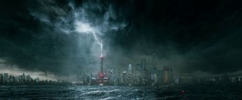 Movie still from “Geostorm” (2017), directed by Dean Devlin – A large city with a tall tower in the middle of the ocean; Extreme Wide shot, High angle