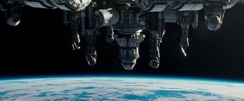 Movie still from “Geostorm” (2017), directed by Dean Devlin – A view of the earth from a space station in space; Extreme Wide shot, Overhead angle