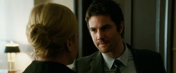 Movie still from “Geostorm” (2017), directed by Dean Devlin – A man and a woman are looking at one another; Close Up shot, Over the shoulder angle