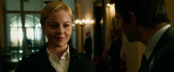 Movie still from “Geostorm” (2017), directed by Dean Devlin – A woman standing next to a man in a room; Close Up shot, Over the shoulder angle