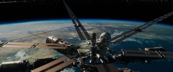 Movie still from “Geostorm” (2017), directed by Dean Devlin – A view of the earth from a space station; Extreme Wide shot, Overhead angle