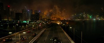 Movie still from “Geostorm” (2017), directed by Dean Devlin – A city street at night lit up by street lights; Extreme Wide shot, High angle