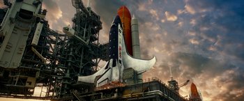 Movie still from “Geostorm” (2017), directed by Dean Devlin – An image of a space shuttle on the launch pad; Extreme Wide shot, Low angle