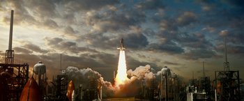 Movie still from “Geostorm” (2017), directed by Dean Devlin – A space shuttle taking off into the sky; Extreme Wide shot, Low angle