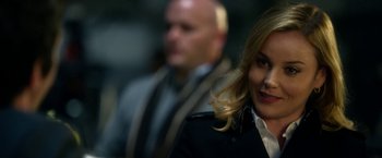 Movie still from “Geostorm” (2017), directed by Dean Devlin – A woman in a black jacket and a man in a black jacket; Close Up shot, Over the shoulder angle