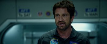 Movie still from “Geostorm” (2017), directed by Dean Devlin – Gerard butler in a scene from the movie olympus has fallen; Close Up shot, Over the shoulder angle