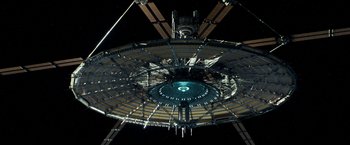 Movie still from “Geostorm” (2017), directed by Dean Devlin – A view of a space station from the ground up; Extreme Wide shot, Overhead angle