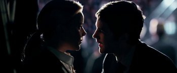 Movie still from “Geostorm” (2017), directed by Dean Devlin – A man and a woman face to face in the dark; Close Up shot, Over the shoulder angle