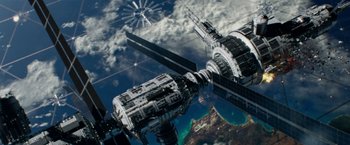 Movie still from “Geostorm” (2017), directed by Dean Devlin – An aerial view of a space station in the sky; Extreme Wide shot, Overhead angle