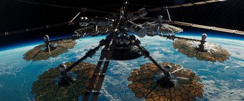 Movie still from “Geostorm” (2017), directed by Dean Devlin – A view of the earth from a space station in space; Extreme Wide shot, Low angle