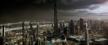 Movie still from “Geostorm” (2017), directed by Dean Devlin – A large city with a dark sky above it; Extreme Wide shot, High angle