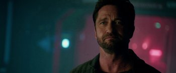 Movie still from “Geostorm” (2017), directed by Dean Devlin – A person wearing a shirt; Close Up shot, Over the shoulder angle