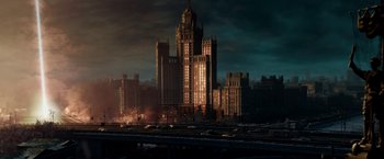 Movie still from “Geostorm” (2017), directed by Dean Devlin – An image of a large building in a city at night time; Extreme Wide shot, Low angle
