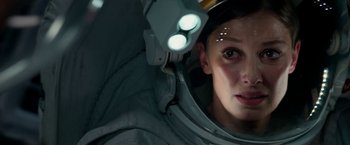 Movie still from “Geostorm” (2017), directed by Dean Devlin – A woman in a spacesuit looking into a mirror; Close Up shot, Overhead angle
