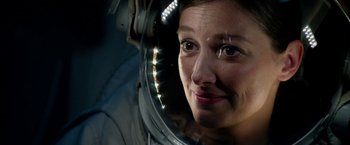 Movie still from “Geostorm” (2017), directed by Dean Devlin – A person wearing a space suit; Close Up shot, Over the shoulder angle