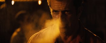 Movie still from “Get the Gringo” (2012), directed by Adrian Grunberg – A person smoking a cigarette; Close Up shot, Low angle