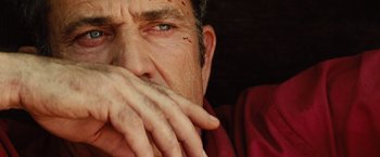 Movie still from “Get the Gringo” (2012), directed by Adrian Grunberg – A man's face with blood all over his face; Extreme Close Up shot, Low angle