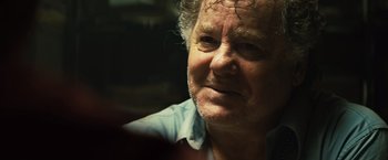 Movie still from “Get the Gringo” (2012), directed by Adrian Grunberg – A person wearing a blue shirt; Close Up shot, Over the shoulder angle