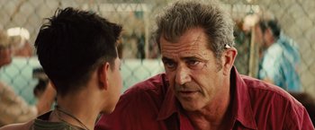Movie still from “Get the Gringo” (2012), directed by Adrian Grunberg – An older man talking to a younger man; Close Up shot, Over the shoulder angle