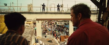 Movie still from “Get the Gringo” (2012), directed by Adrian Grunberg – A crowd of people standing on top of a building; Wide shot, Over the shoulder angle