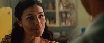 Movie still from “Get the Gringo” (2012), directed by Adrian Grunberg – A woman's face in a room; Close Up shot, Over the shoulder angle