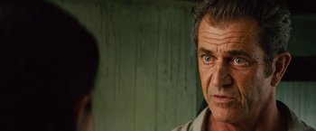 Movie still from “Get the Gringo” (2012), directed by Adrian Grunberg – A person looking at the camera; Close Up shot, Over the shoulder angle