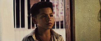 Movie still from “Get the Gringo” (2012), directed by Adrian Grunberg – A young man is looking into the distance; Close Up shot, Over the shoulder angle