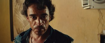 Movie still from “Get the Gringo” (2012), directed by Adrian Grunberg – A person wearing a shirt; Close Up shot, Low angle