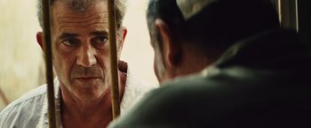Movie still from “Get the Gringo” (2012), directed by Adrian Grunberg – A person looking at another person; Close Up shot, Over the shoulder angle