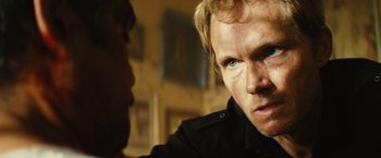 Movie still from “Get the Gringo” (2012), directed by Adrian Grunberg – A person with blue eyes; Close Up shot, Over the shoulder angle