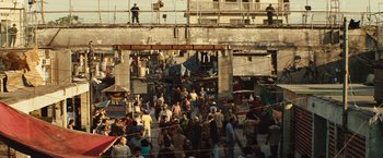 Movie still from “Get the Gringo” (2012), directed by Adrian Grunberg – A group of people standing on top of a building next to a street; Extreme Wide shot, High angle