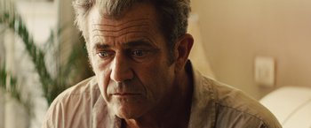 Movie still from “Get the Gringo” (2012), directed by Adrian Grunberg – An older man is looking at the camera; Close Up shot, Over the shoulder angle