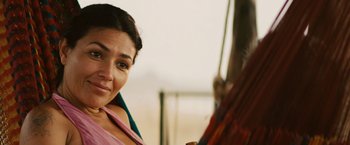 Movie still from “Get the Gringo” (2012), directed by Adrian Grunberg – A woman's face on the side of a bus; Close Up shot, Over the shoulder angle