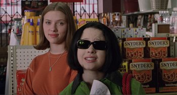 Movie still from “Ghost World” (2001), directed by Terry Zwigoff – Two women standing next to each other in a store; Medium shot, Low angle
