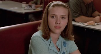 Movie still from “Ghost World” (2001), directed by Terry Zwigoff – A person sitting at a table; Close Up shot, Over the shoulder angle
