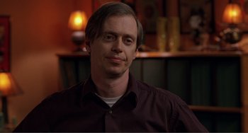 Movie still from “Ghost World” (2001), directed by Terry Zwigoff – A person wearing a brown shirt; Close Up shot, High angle