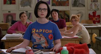 Movie still from “Ghost World” (2001), directed by Terry Zwigoff – A group of people sitting around a table; Medium shot, Over the shoulder angle