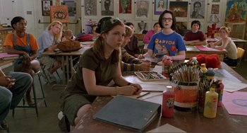 Movie still from “Ghost World” (2001), directed by Terry Zwigoff – A group of people sitting around a table; Medium shot, Over the shoulder angle