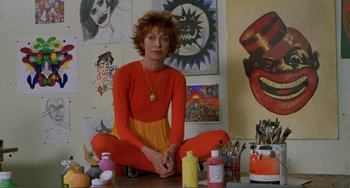 Movie still from “Ghost World” (2001), directed by Terry Zwigoff – A woman sitting on the floor in front of a painting; Medium shot, Low angle