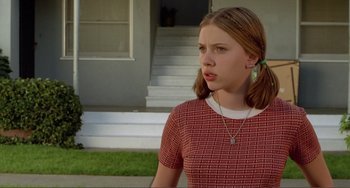 Movie still from “Ghost World” (2001), directed by Terry Zwigoff – A young girl in a red and white dress; Medium shot, Low angle