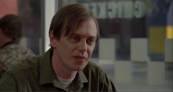 Movie still from “Ghost World” (2001), directed by Terry Zwigoff – A person wearing a green shirt; Close Up shot, Over the shoulder angle