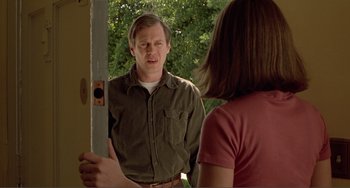 Movie still from “Ghost World” (2001), directed by Terry Zwigoff – A man and a woman standing in front of each other; Medium shot, Over the shoulder angle