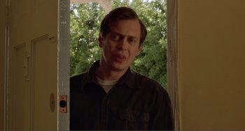 Movie still from “Ghost World” (2001), directed by Terry Zwigoff – A man standing in front of a door looking angry; Close Up shot, Low angle