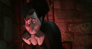 Movie still from “Hotel Transylvania” (2012), directed by Genndy Tartakovsky – A cartoon character with a ring in his mouth; Close Up shot, Over the shoulder angle