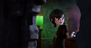 Movie still from “Hotel Transylvania” (2012), directed by Genndy Tartakovsky – A cartoon character is looking at a stone wall; Medium shot, Over the shoulder angle